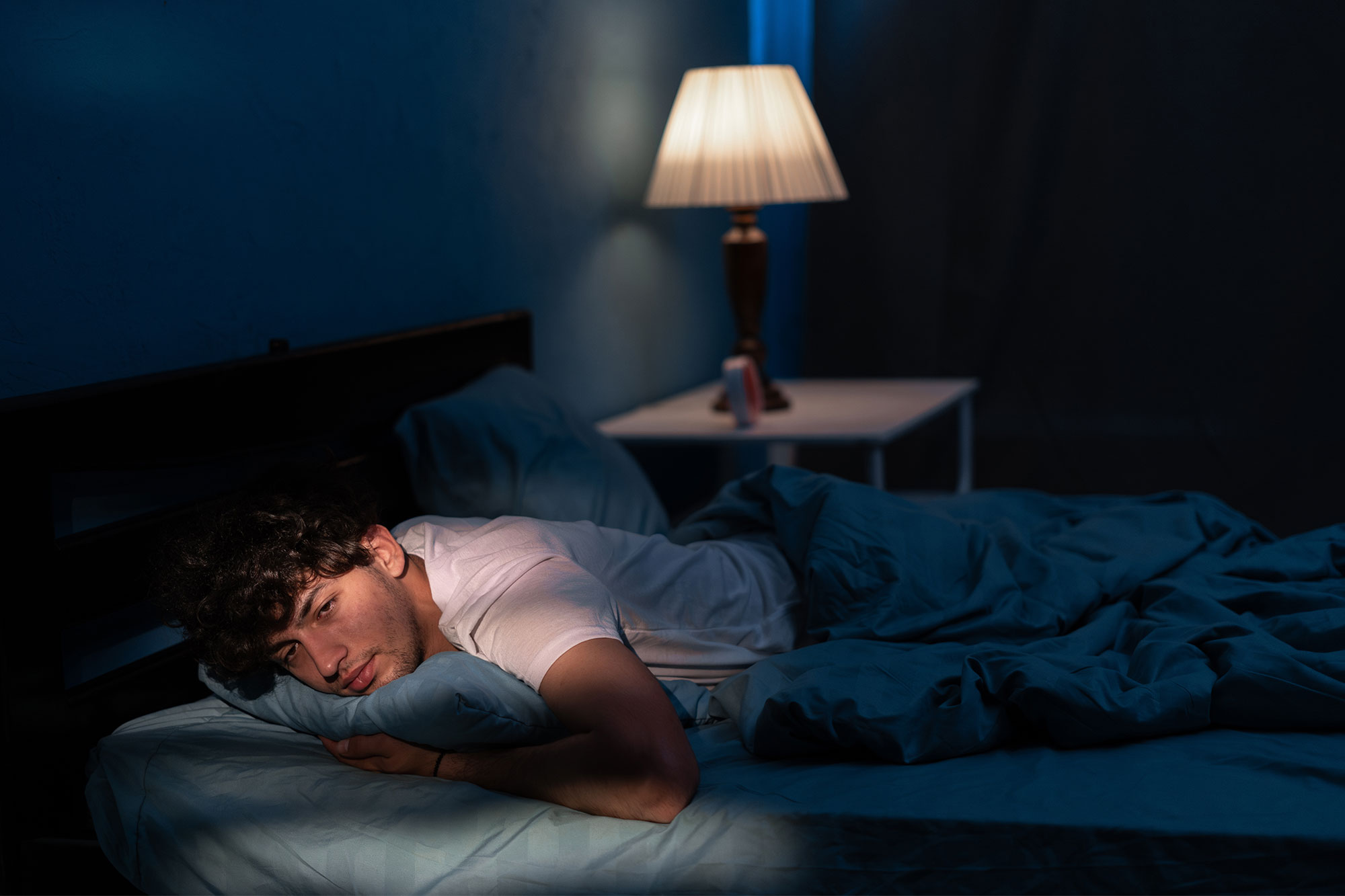 male sleeping with eyes open from insomnia